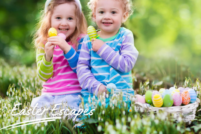 Two children with Easter eggs and writing saying 